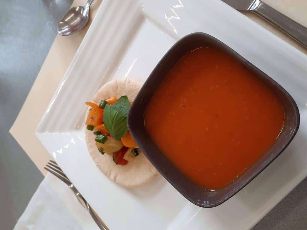 soup of roasted cherry tomatoes, salsa and pita