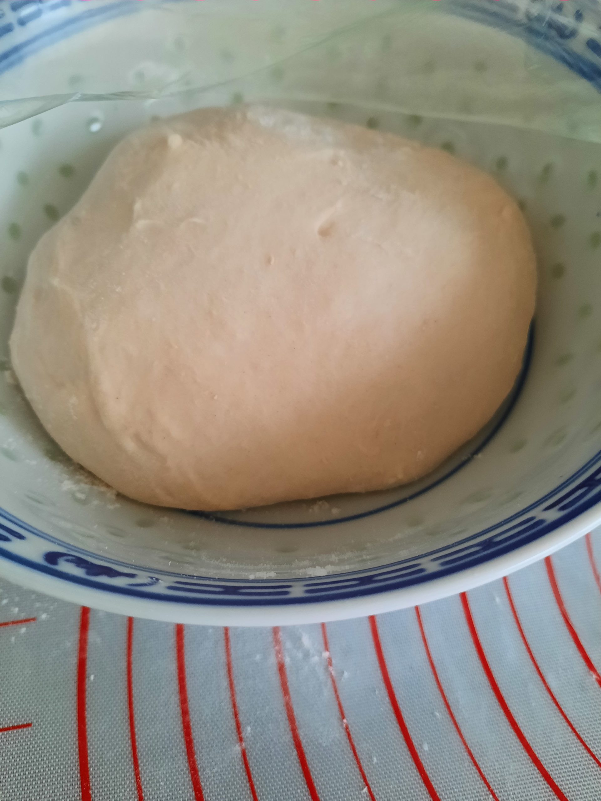 Take the dough out of the mixing bowl. Once dusted with hand flour, fold the dough in half and turn 90 degrees, then fold in half again. Repeat turning, folding in half, finishing to smooth surface. Then start our base fermentation