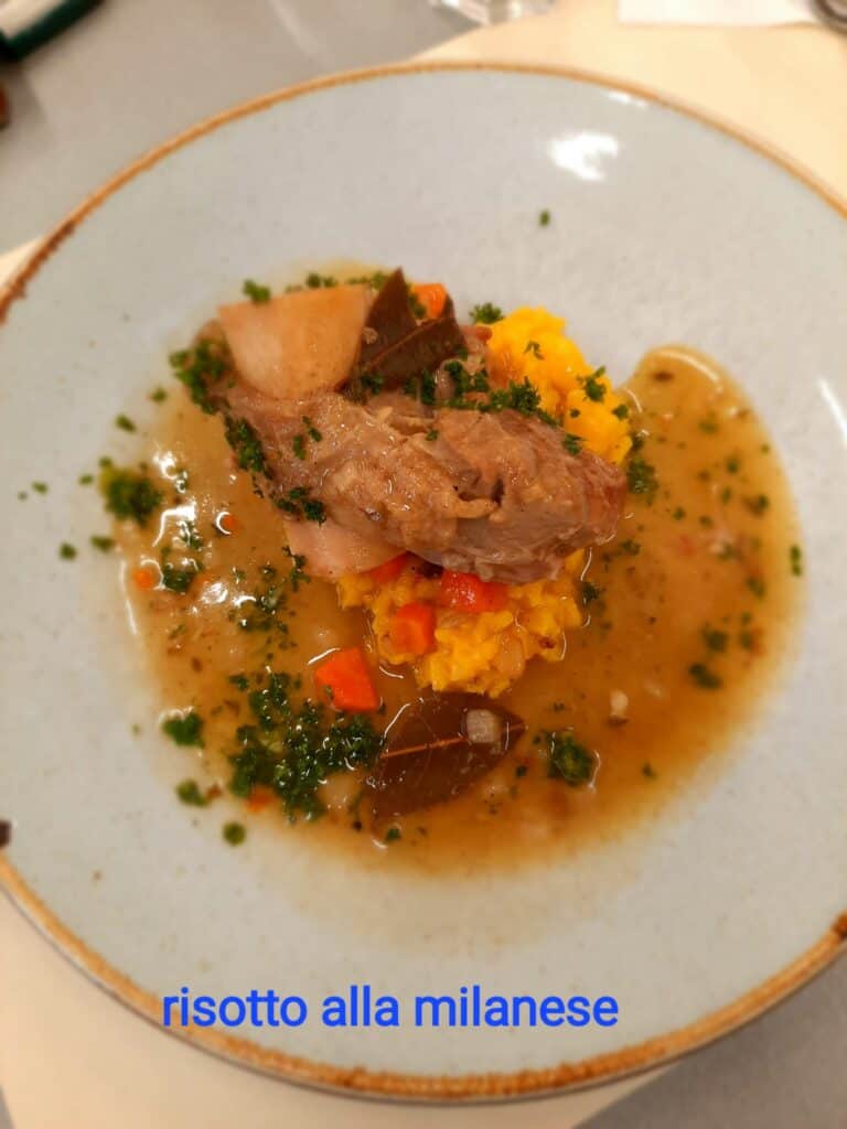 After the ossobuco and risotto are finished, they can be served on a plate for guests to enjoy