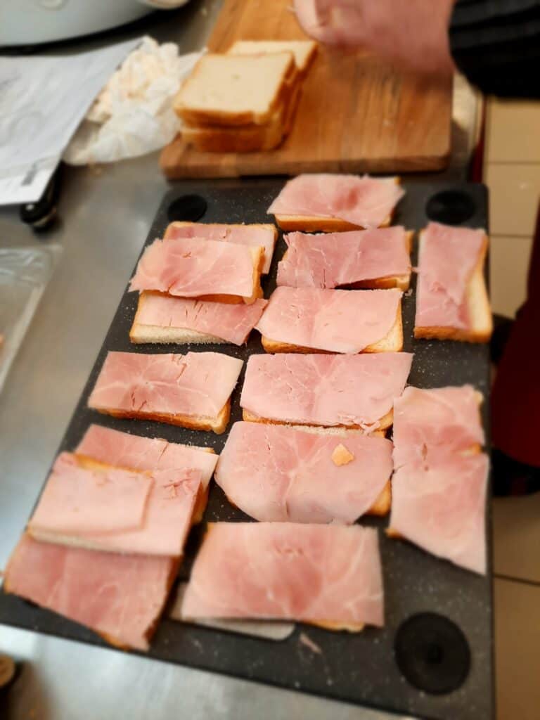 Place slices of ham and cheese on toast