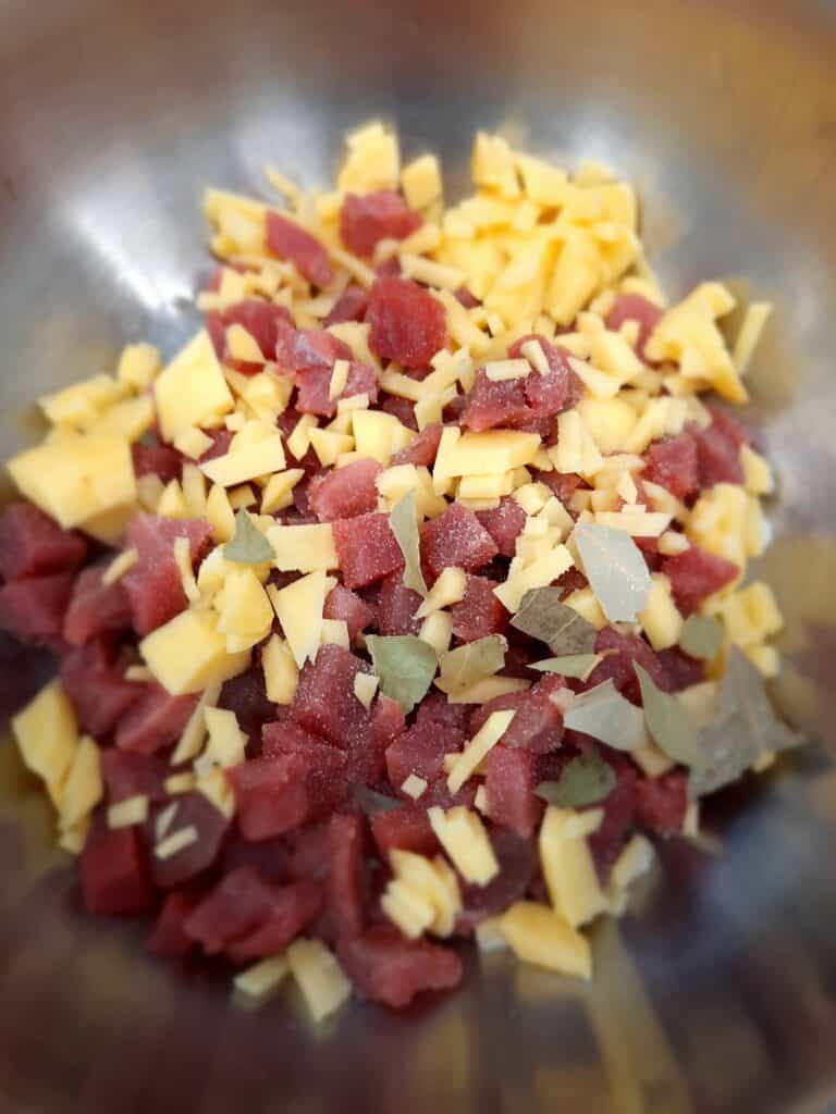 fresh tuna cut into small pieces Tuna Poached with Potato Bay Leaves
