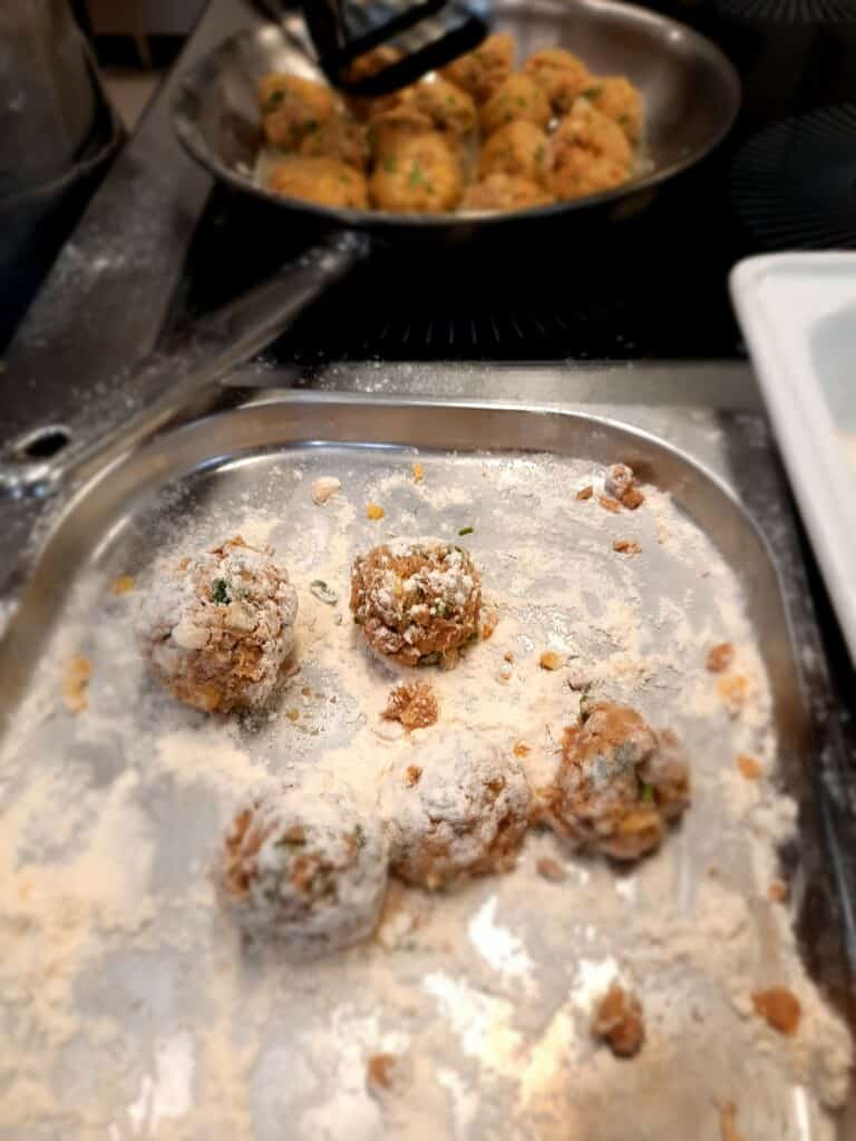 shape into meatballs and dust with flour