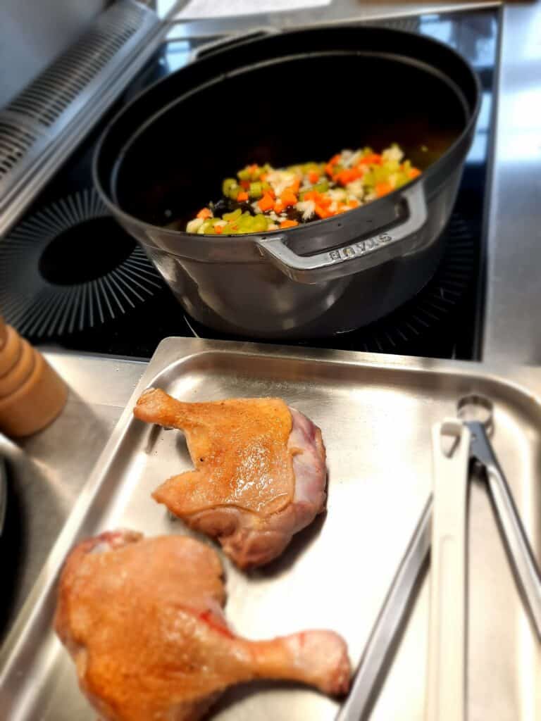brown the duck legs on all sides and remove from the pan
stew the chopped vegetables in it