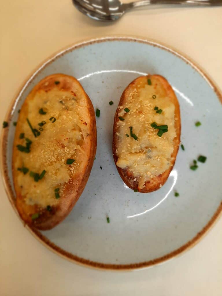 grill for 5 minutes or until golden brown
serve the stuffed potatoes warmed and garnish with freshly chopped chives