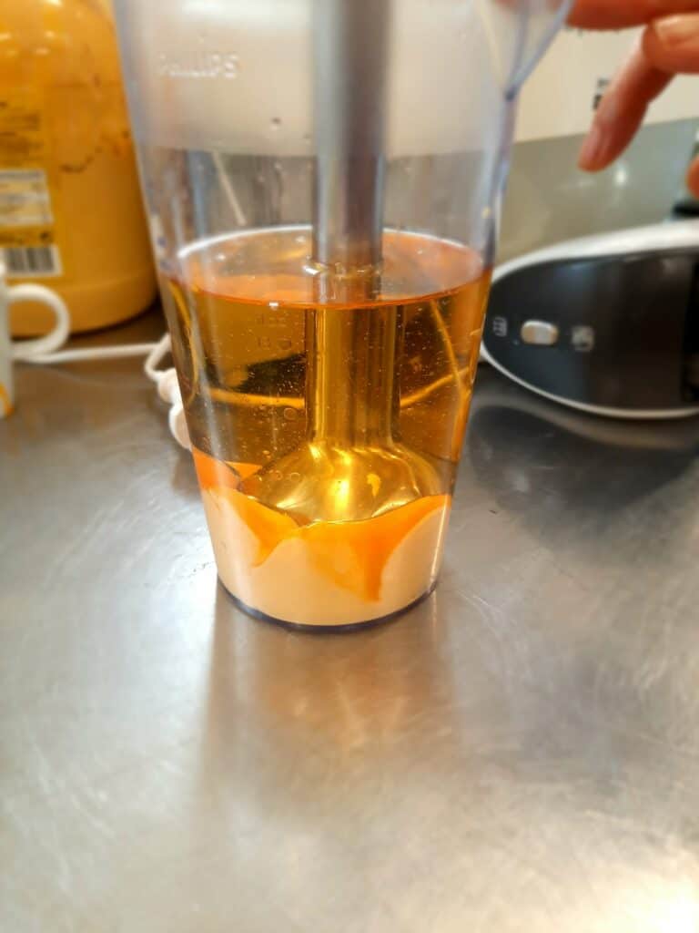3 egg yolks plus 200ml of cooking oil, starting from the bottom with an electric mixer