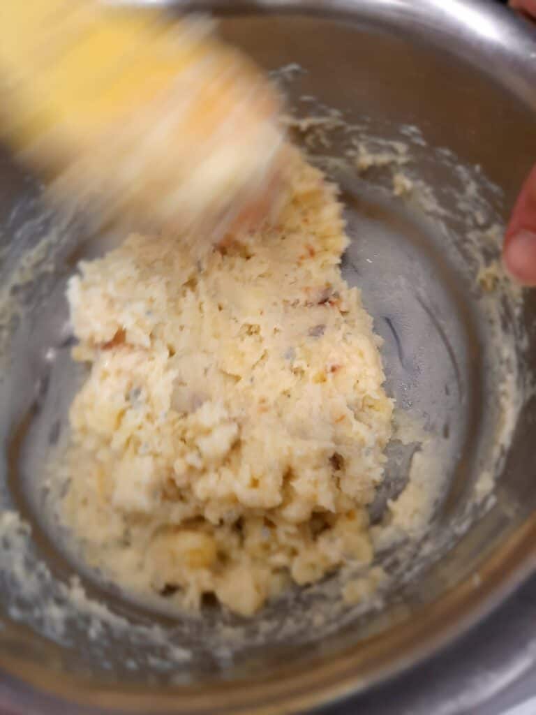 scoop the potato crumbs into a bowl
add the gorgozola, a little salt and pepper and mix
